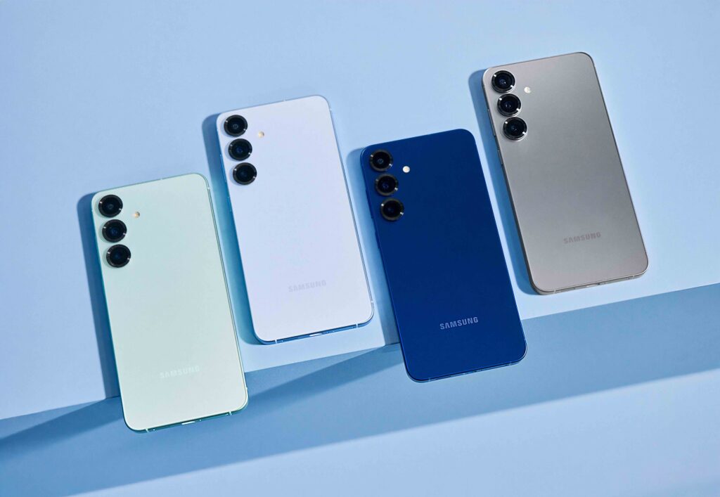 Four Samsung Galaxy S25 smartphones displayed in mint green, white, blue, and silver colours with rear triple-camera design.
